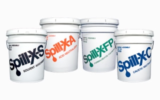 A set of cans of Spill-X spill control agents